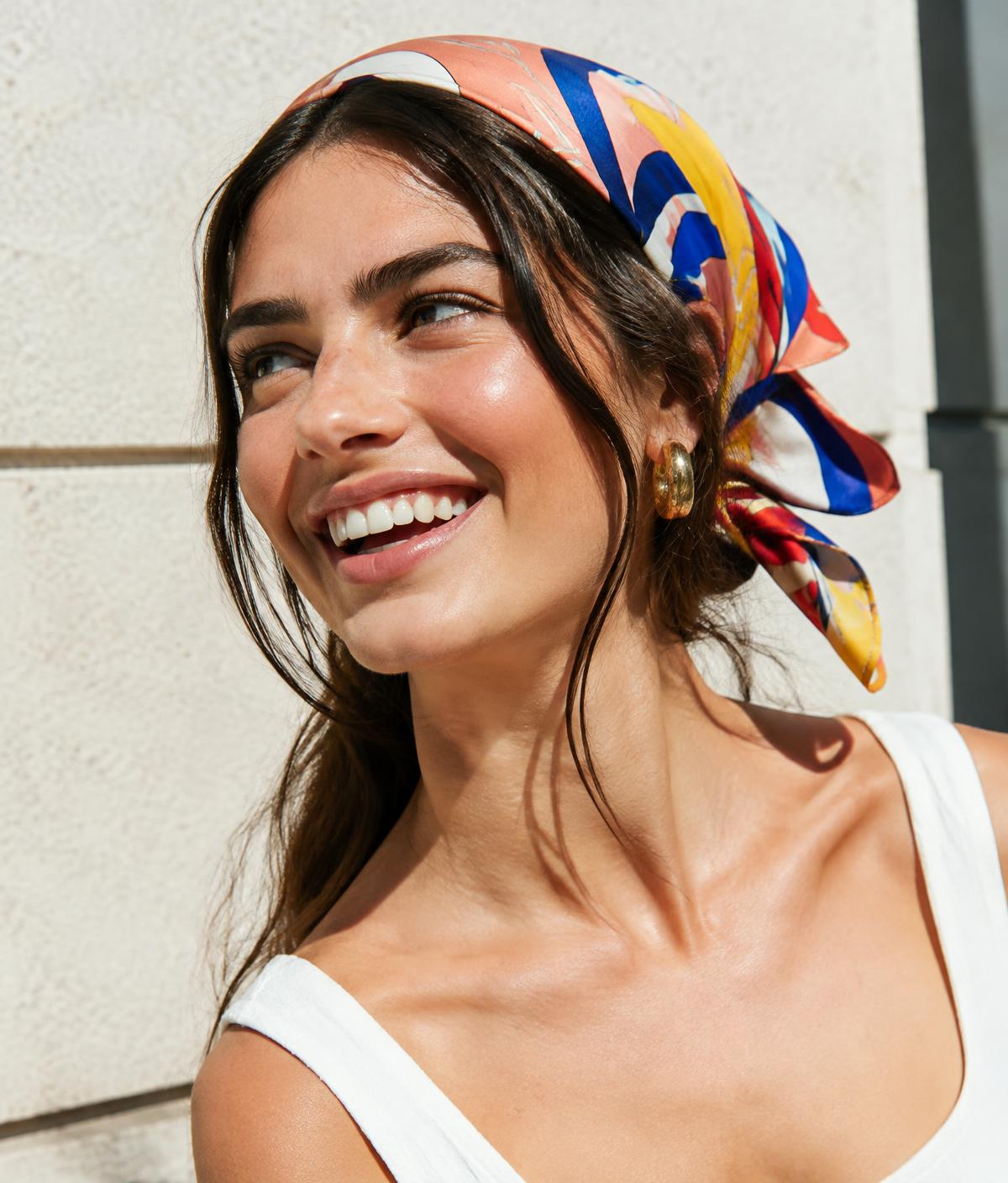 Woman wearing a colorful scarf as a hair bandana