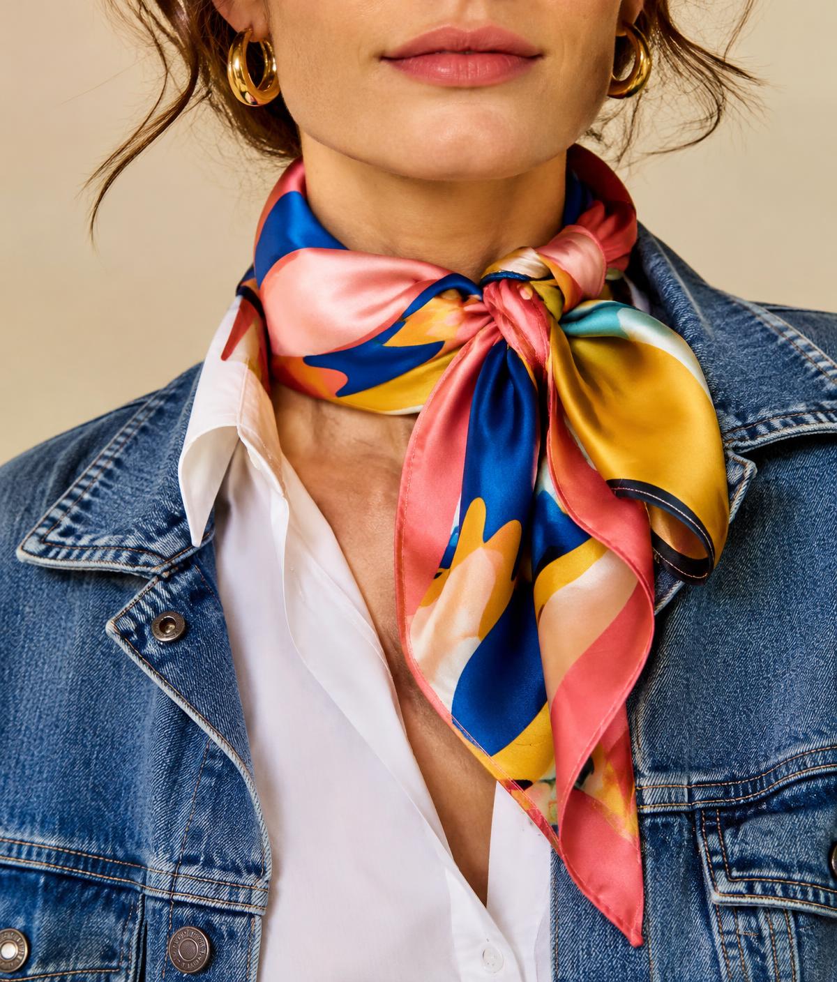 Colorful silk scarf tied around the neck