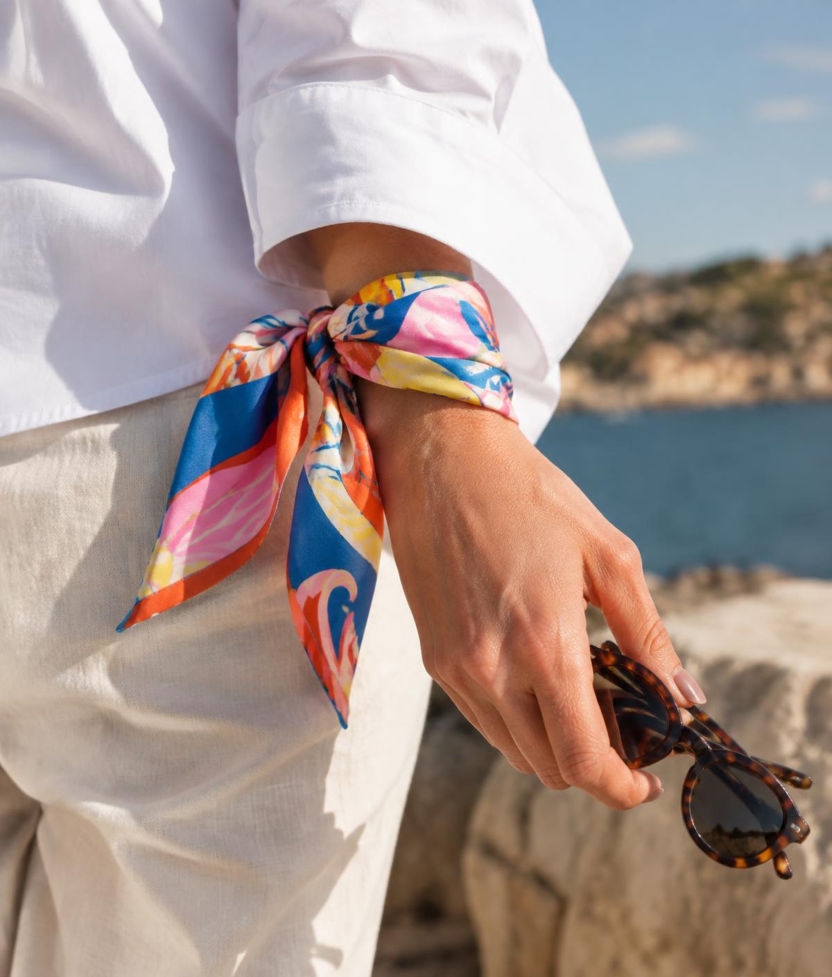 Colorful silk scarf wrapped around a wrist
